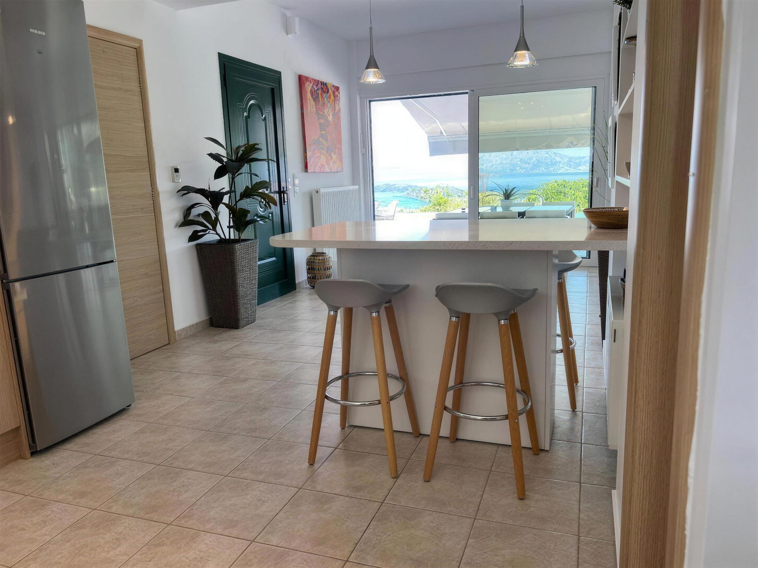 The kitchen, with its breakfast bar and stools