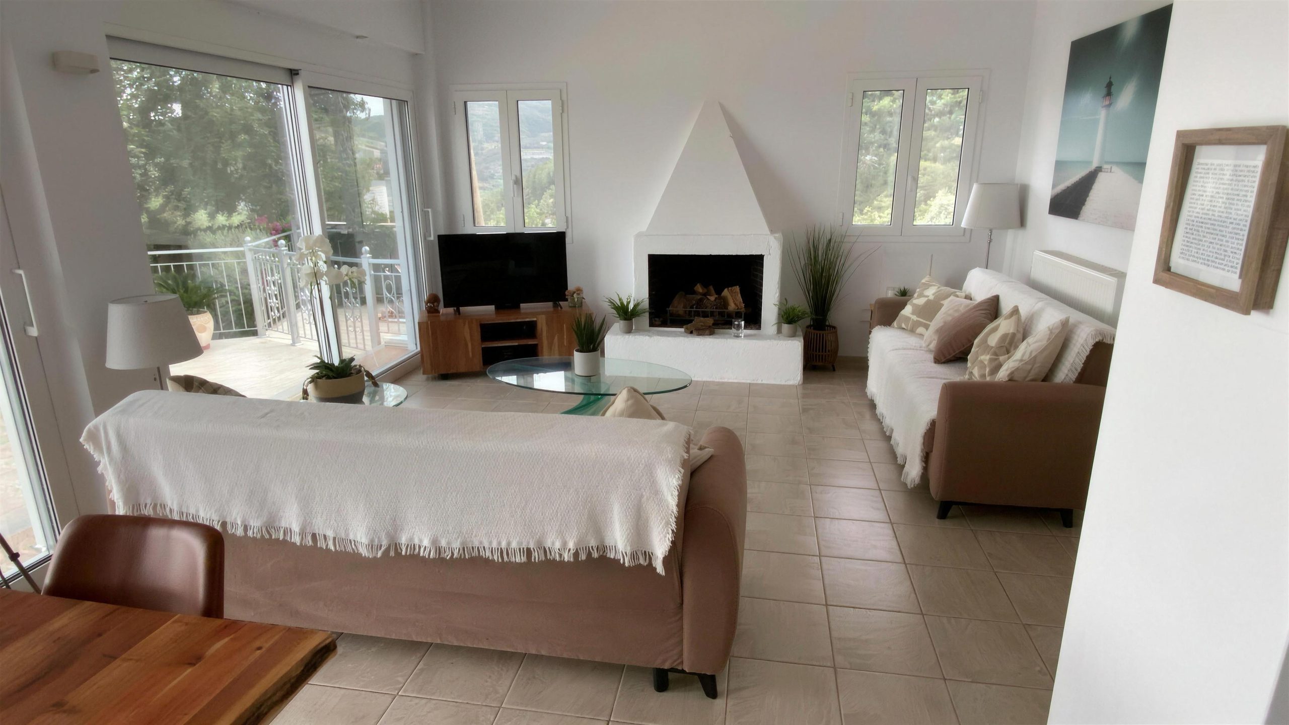 The sitting room, its fireplace and the television