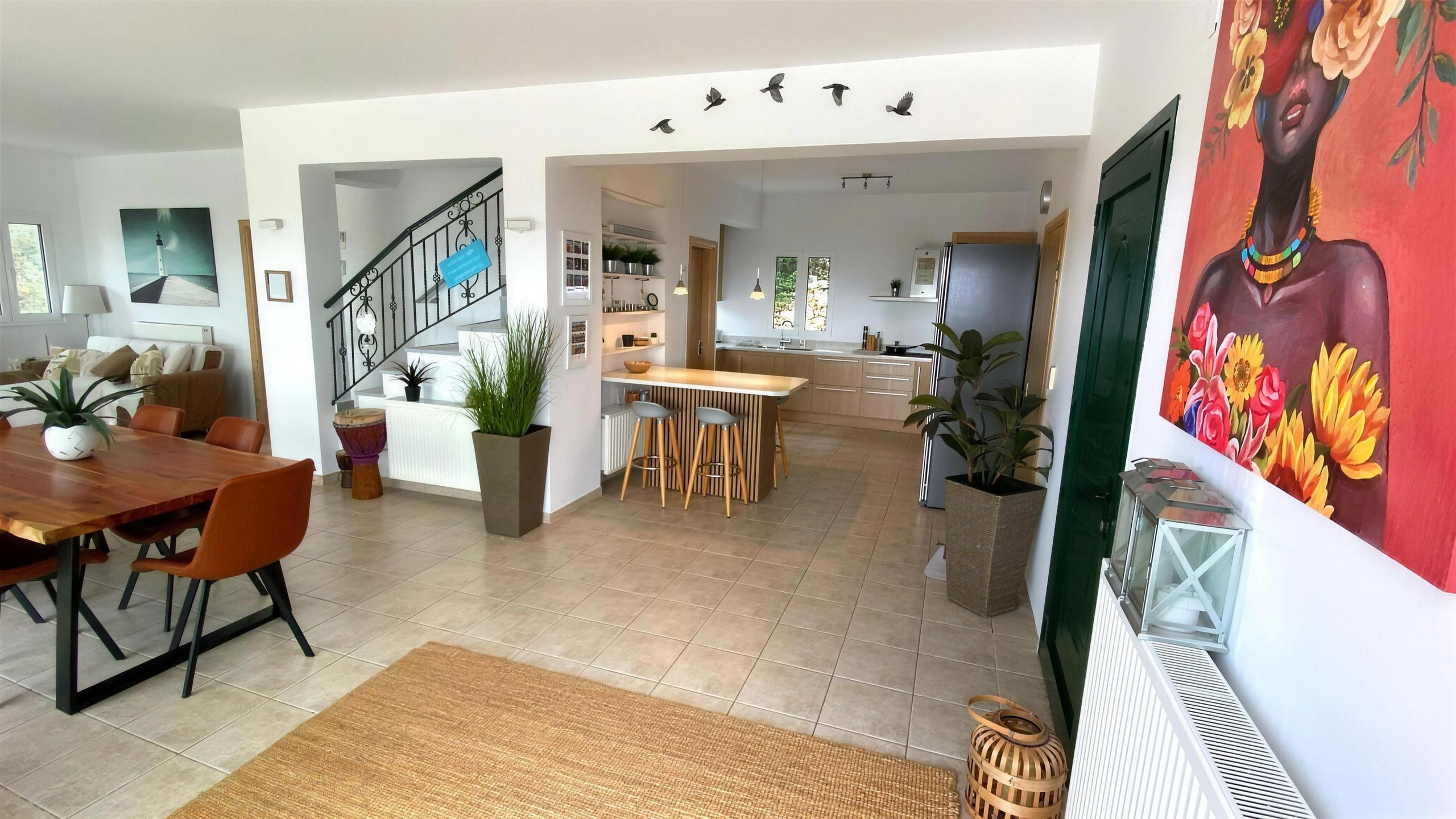 The living room looking through to the staircase and the dining end