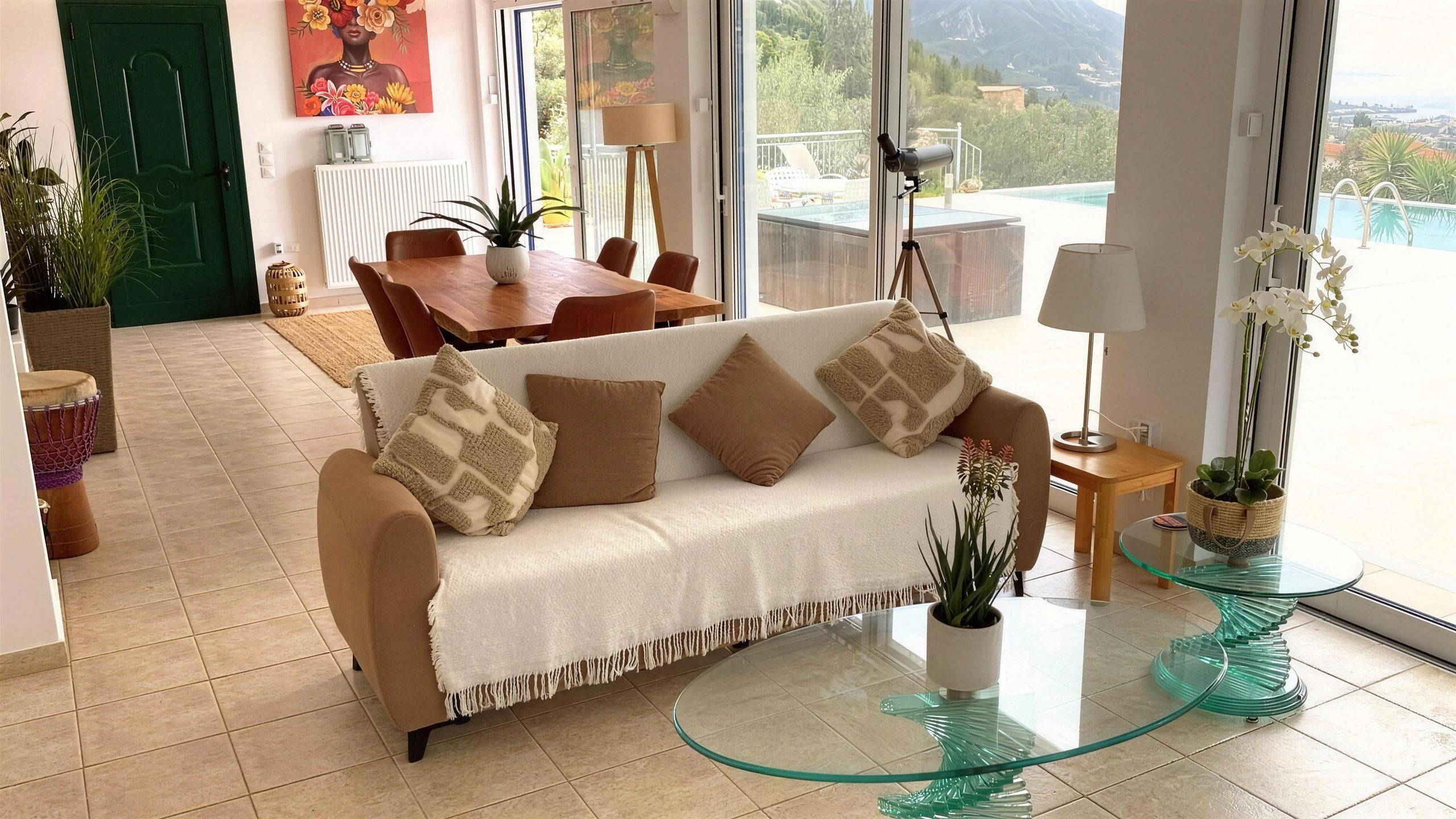 The living room with its doors open onto the pool terrace