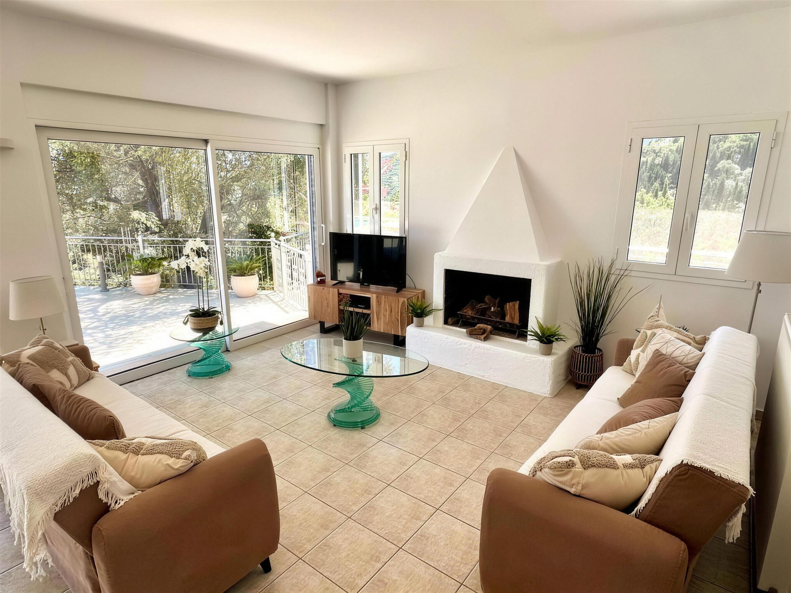 Armchairs and sofas drawn round the fireplace